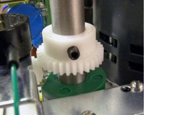 Place the potentiometer gear down over the shaft with the gear down and the set screw up